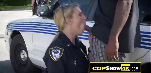  Public threeway with a black criminal and two busty MILF officers.